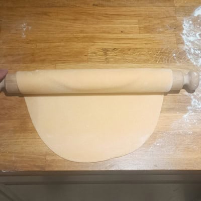 Turning over homemade pasta dough