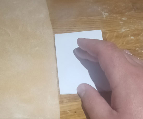 Checking the thickness of homemade pasta