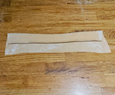 Folding homemade pasta dough for cutting
