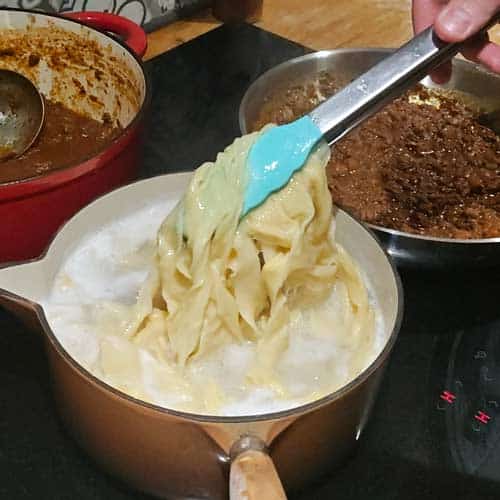 Removing cooked homemade pasta